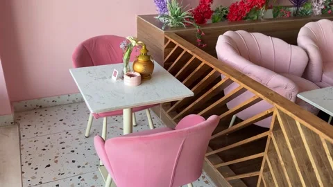 Modern Pink Cafe Interior with Marble Table and Upholstered Chairs 動画素材 331556470