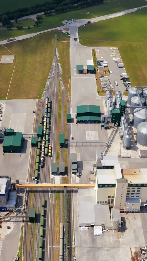 Modern plant with grain elevators on field Stock Footage 295072551