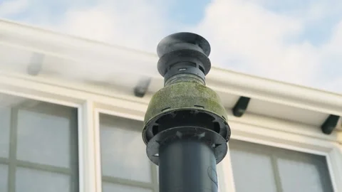 Modern plastic chimney with smoke in winter Stock Footage 262481371