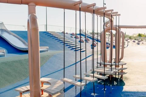 Modern playground with climbing elements and swings Stock Photos