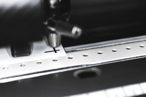 Modern plotter laser cutter machine in print house industry, close-up view ph Stock Photos