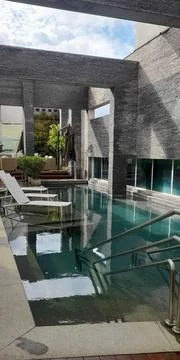 Modern Pool in a Cozy Setting Stock Photos