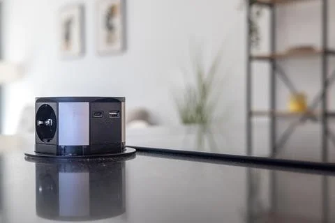 Modern pop-up power socket with USB ports on kitchen countertop Stock Photos