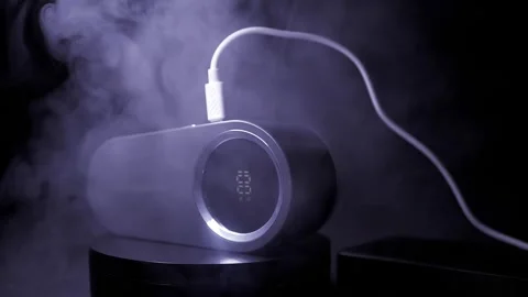 Modern Portable Humidifier Charging With USB Cable Amidst Thick Smoke Stock Footage 330110508