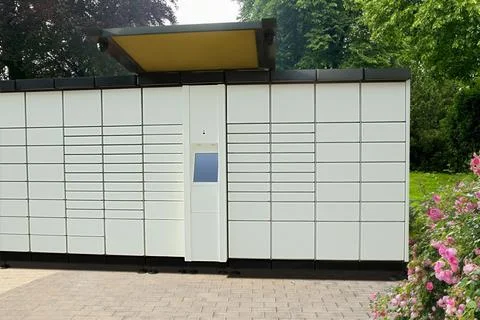 Modern postal machine for parcels and letters outdoors Stock Photos