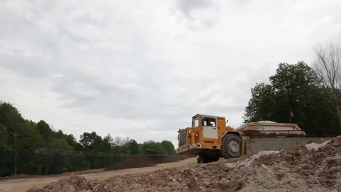 Modern Powerful Dumper with Yellow Cabine Drives against Sky Stock Footage