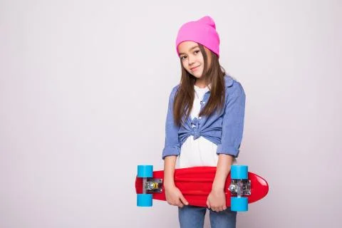 Modern pre teens lifestyle concept. Charming active school girl in fashionabl Stock Photos