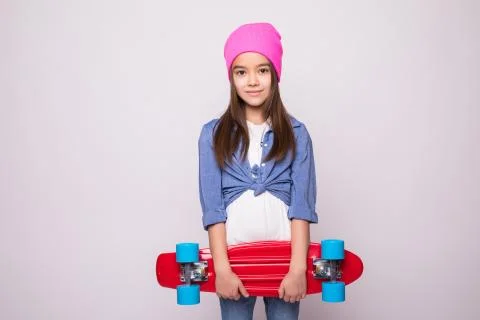 Modern pre teens lifestyle concept. Charming active school girl in fashionabl Stock Photos