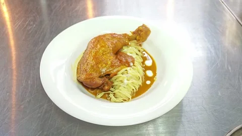 Modern presentation of Northern Thai curry noodles Khao Soi Chicken. Video stock 343224446