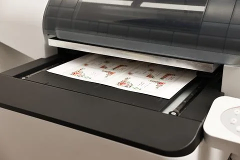 Modern printer with printed wedding invitation cards indoors, closeup. Prin.. Stock Photos