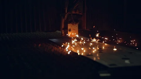 Modern programmed robot head cuts metal with sparks. Stock Footage 104023089