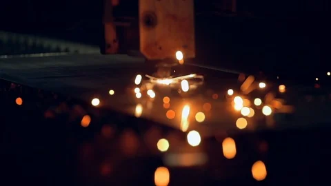 Modern programmed robot head cuts metal with sparks. Stock Footage 104025916