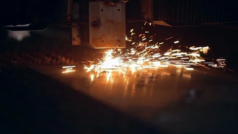 Modern programmed robot head cuts metal with sparks. Stock Footage 104040475