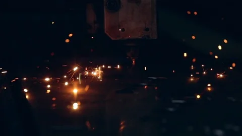 Modern programmed robot head cuts metal with sparks. Stock Footage 104041768