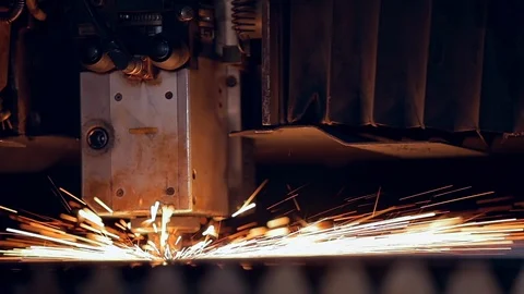 Modern programmed robot head cuts metal with sparks. Video stock 104047231