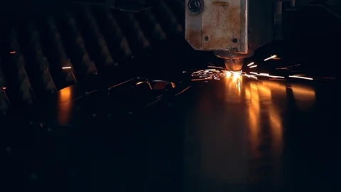 Modern programmed robot head cuts metal with sparks. Stock Footage 104049726