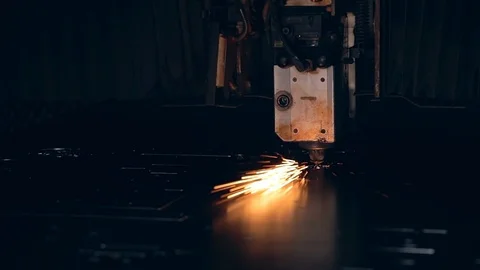 Modern programmed robot head cuts metal with sparks. Stock Footage 104066308