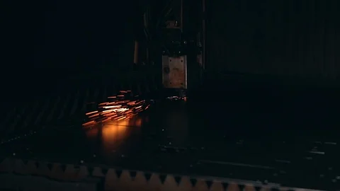 Modern programmed robot head cuts metal with sparks. Stock Footage 104066686