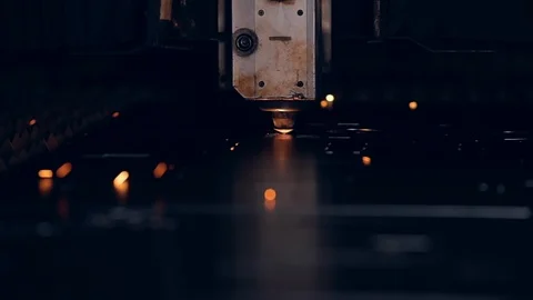 Modern programmed robot head cuts metal with sparks. Stock Footage 104071230