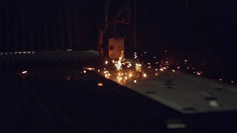 Modern programmed robot head cuts metal with sparks. Stock Footage 104638517