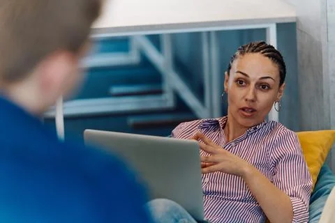 A modern programmer discussing future business projects with colleagues in a Stock Photos