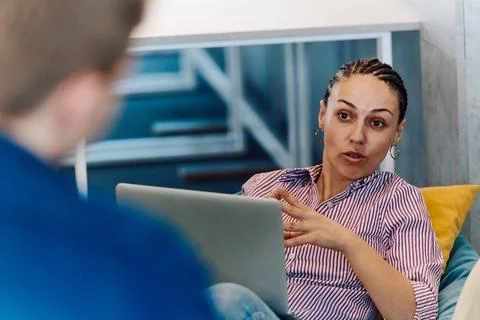 A modern programmer discussing future business projects with colleagues in a Stock Photos