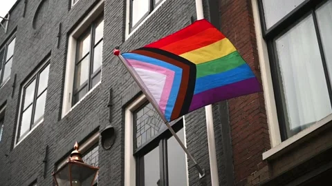 Modern, progress LGBTQ pride flag during pride month of June, slow motion Stock Footage 196194742