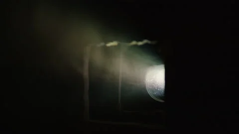 Modern projector light and flying smoke on foreground Stock Footage 91119353
