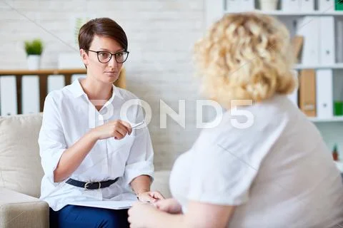 Modern psychologist consulting woman with overweight Stock Photos