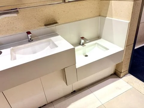Modern Public Restroom Sinks with Automatic Faucets Stock Photos