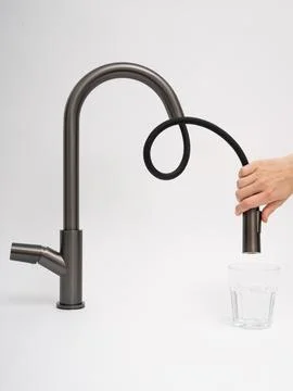 Modern pull-down kitchen faucet on white background Stock Photos