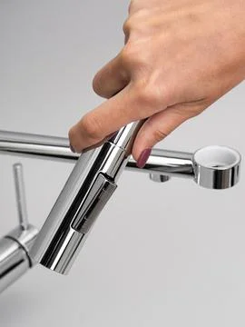 Modern pull-down kitchen faucet on white background 写真素材