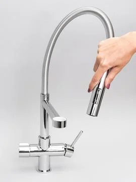 Modern pull-down kitchen faucet on white background Fotos de archivo