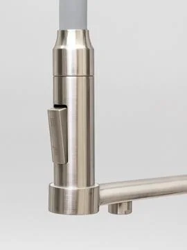 Modern pull-down kitchen faucet on white background Stock Photos