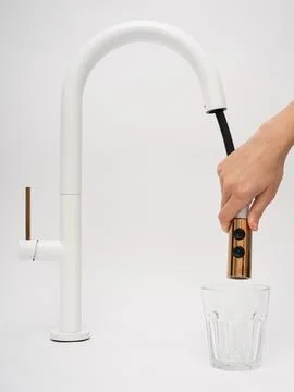 Modern pull-down kitchen faucet on white background Fotos Stock
