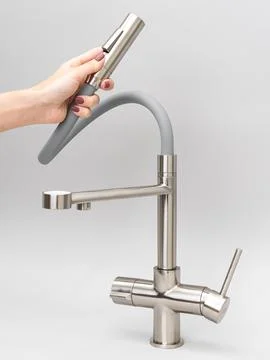 Modern pull-down kitchen faucet on white background Stock Photos