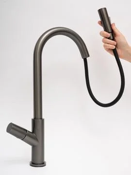 Modern pull-down kitchen faucet on white background Fotos de archivo