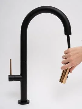 Modern pull-down kitchen faucet on white background Stock Photos