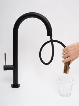 Modern pull-down kitchen faucet on white background Stock Photos