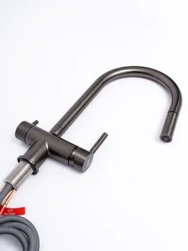 Modern pull-down kitchen faucet on white background Stock Photos