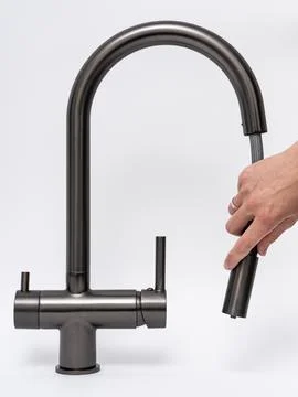 Modern pull-down kitchen faucet on white background Fotos Stock