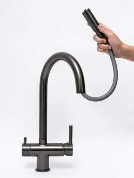 Modern pull-down kitchen faucet on white background Stock Photos