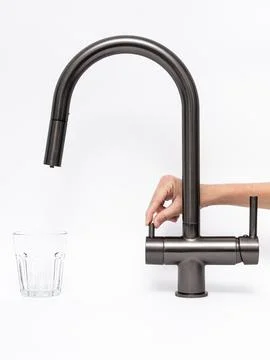 Modern pull-down kitchen faucet on white background Stock Photos