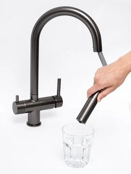 Modern pull-down kitchen faucet on white background Fotos Stock