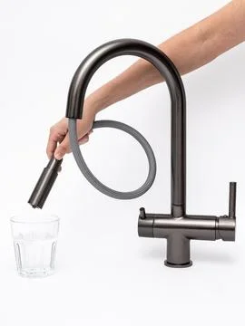 Modern pull-down kitchen faucet on white background Stock Photos