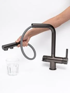 Modern pull-down kitchen faucet on white background Stock Photos