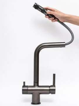 Modern pull-down kitchen faucet on white background Stock Photos