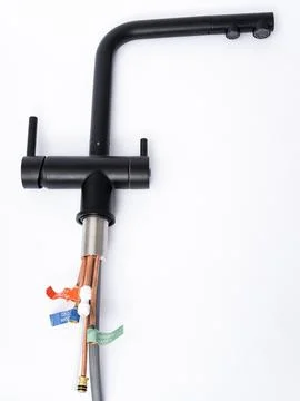 Modern pull-down kitchen faucet on white background Stock Photos