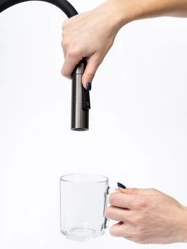 Modern pull-down kitchen faucet on white background 写真素材