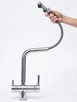 Modern pull-down kitchen faucet on white background Stock Photos
